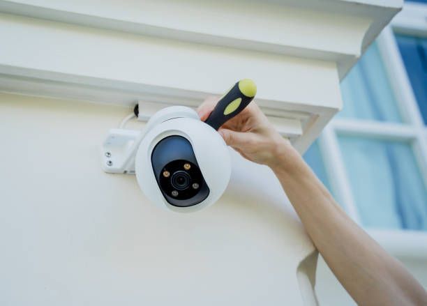 CCTV technician performing camera maintenance in Dubai