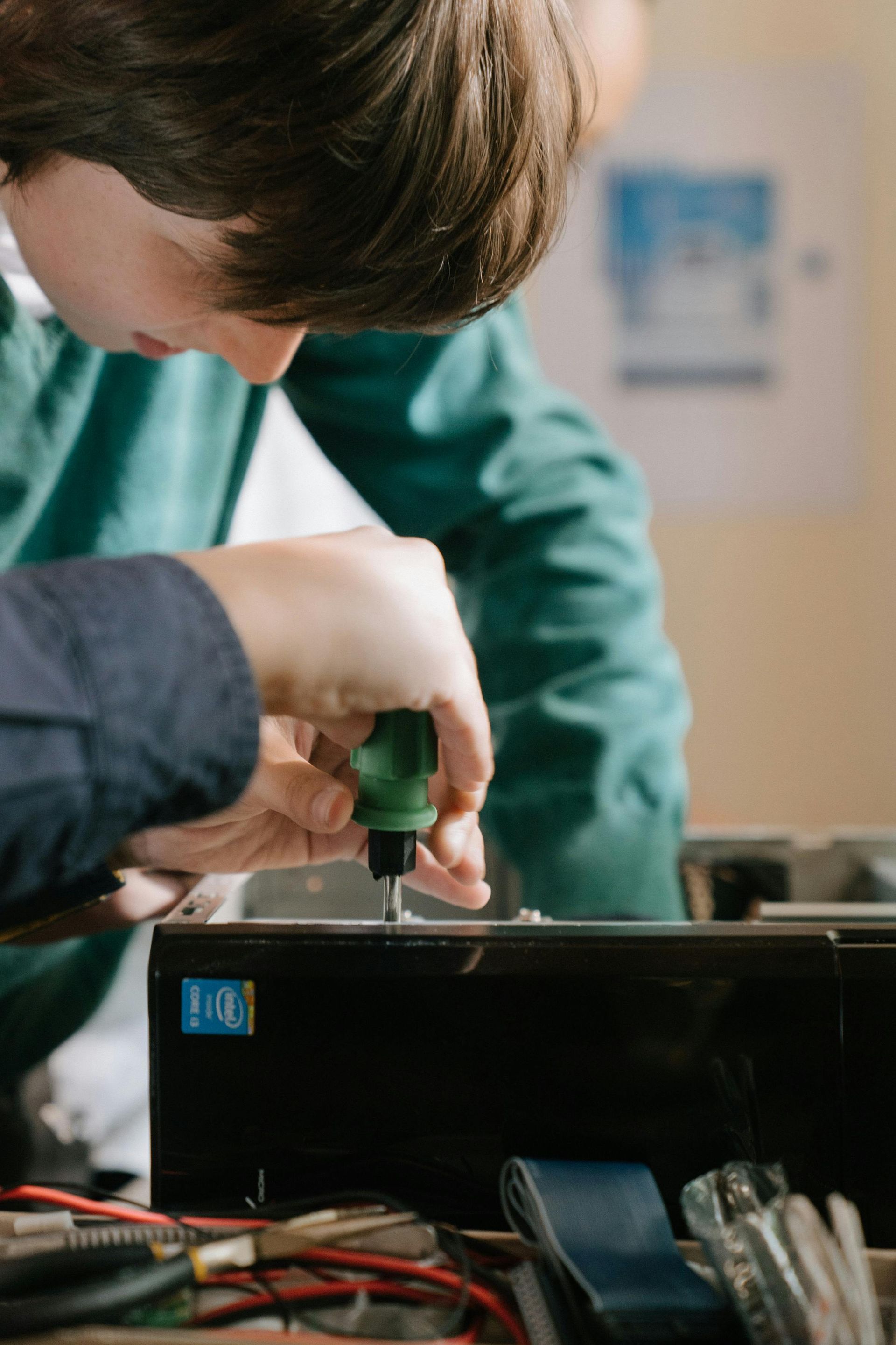 IT technician repairing desktop computer – Dubai on-site IT support