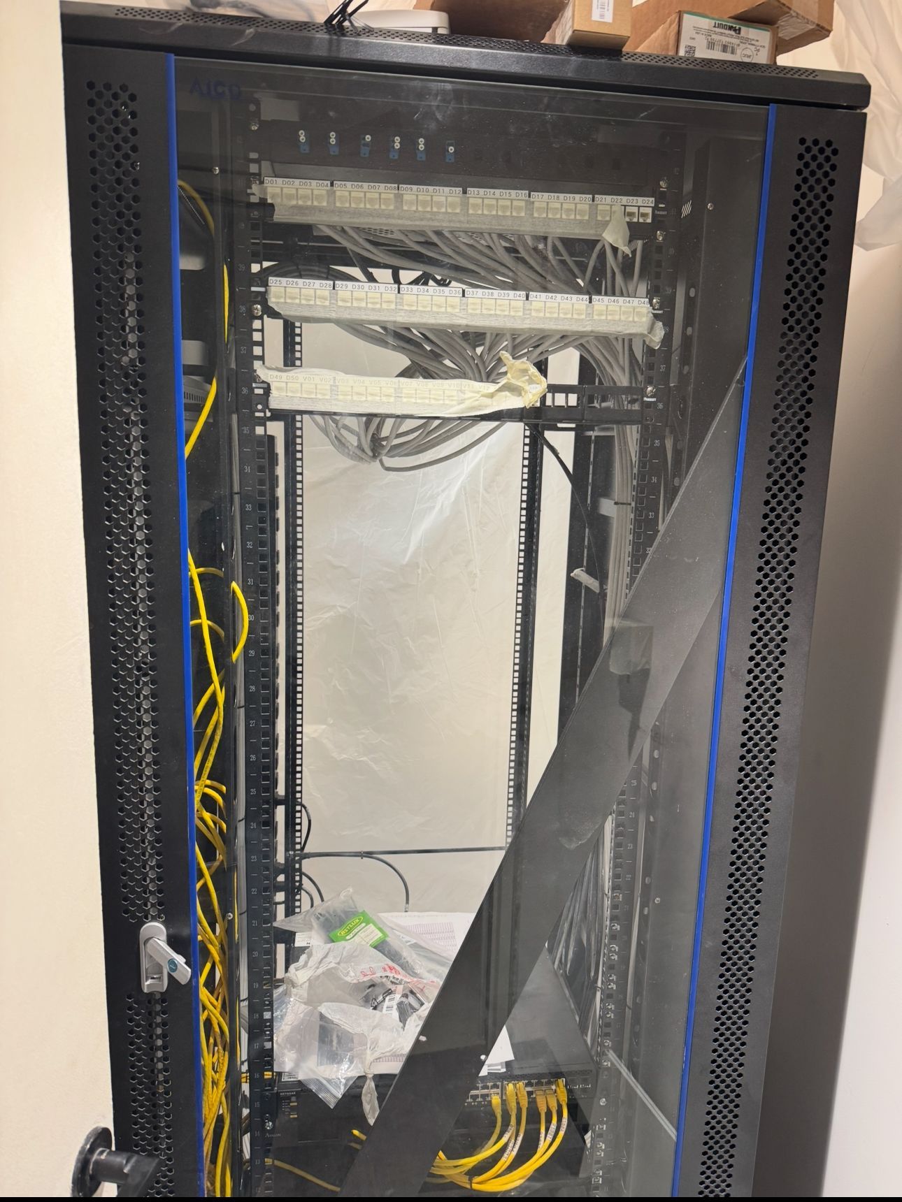 Before image of messy server cabinet at People Creative Hub, Yas Island
