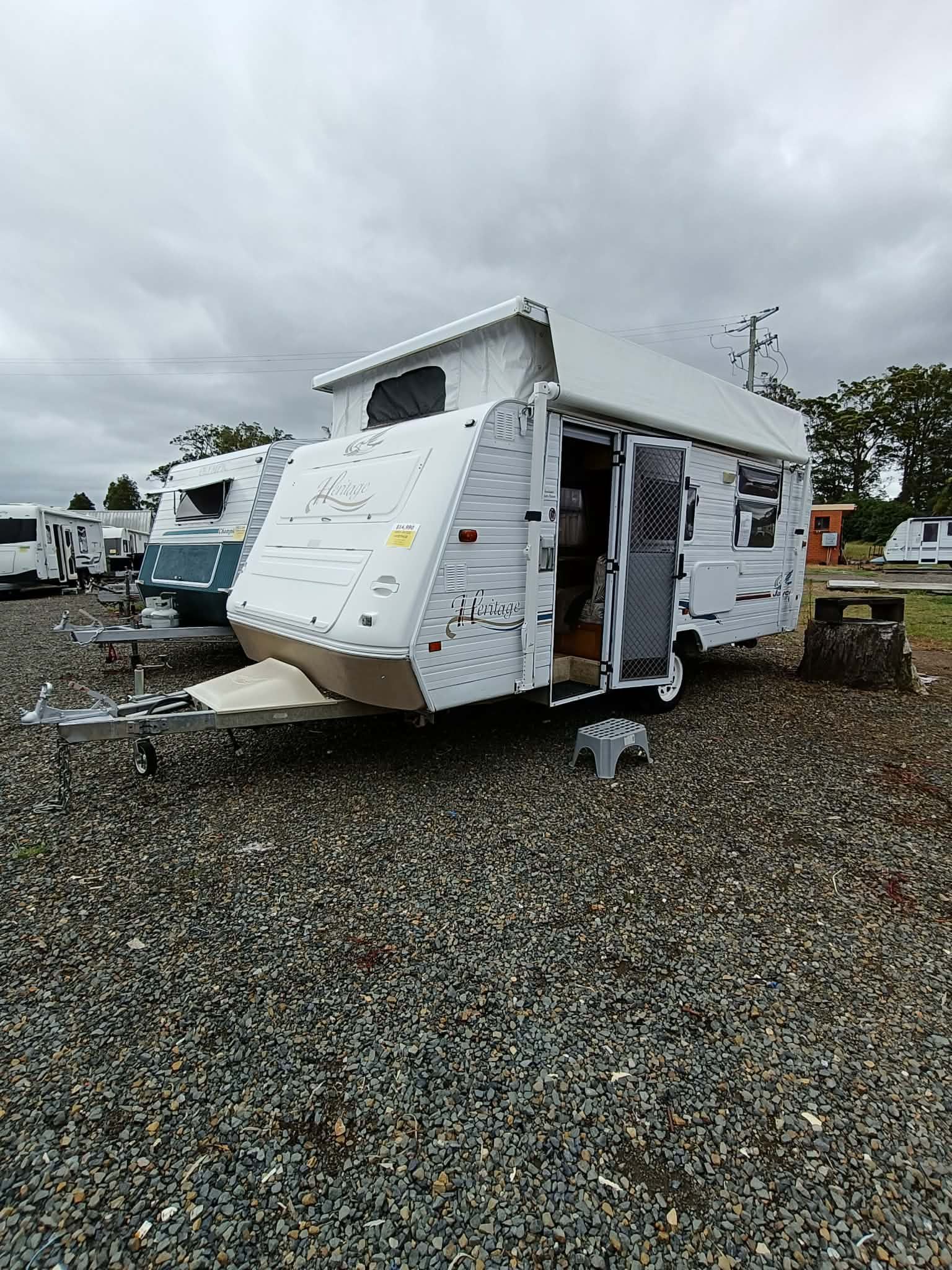 White Pop-top Caravan Parked on Gravel, With Door Open — Great Lakes Caravans & RV P/L In Nabiac, NSW