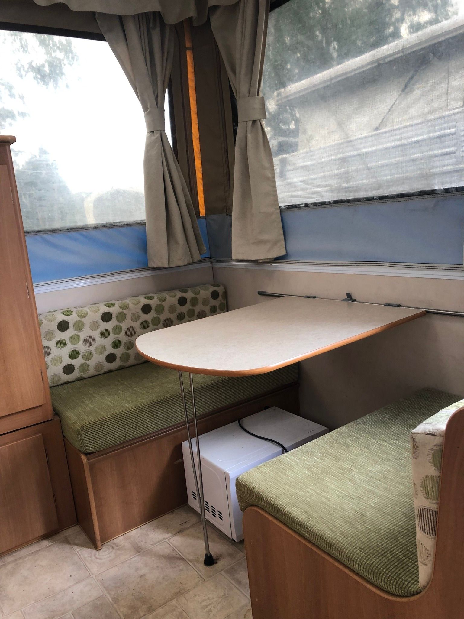 Interior of a Pop-up Camper With a Booth Seating Area — Great Lakes Caravans & RV P/L In Mid North Coast, NSW