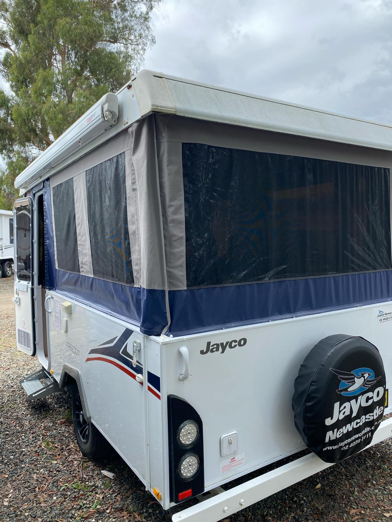 White Jayco Camper Trailer With a Spare Tire — Great Lakes Caravans & RV P/L In Mid North Coast, NSW