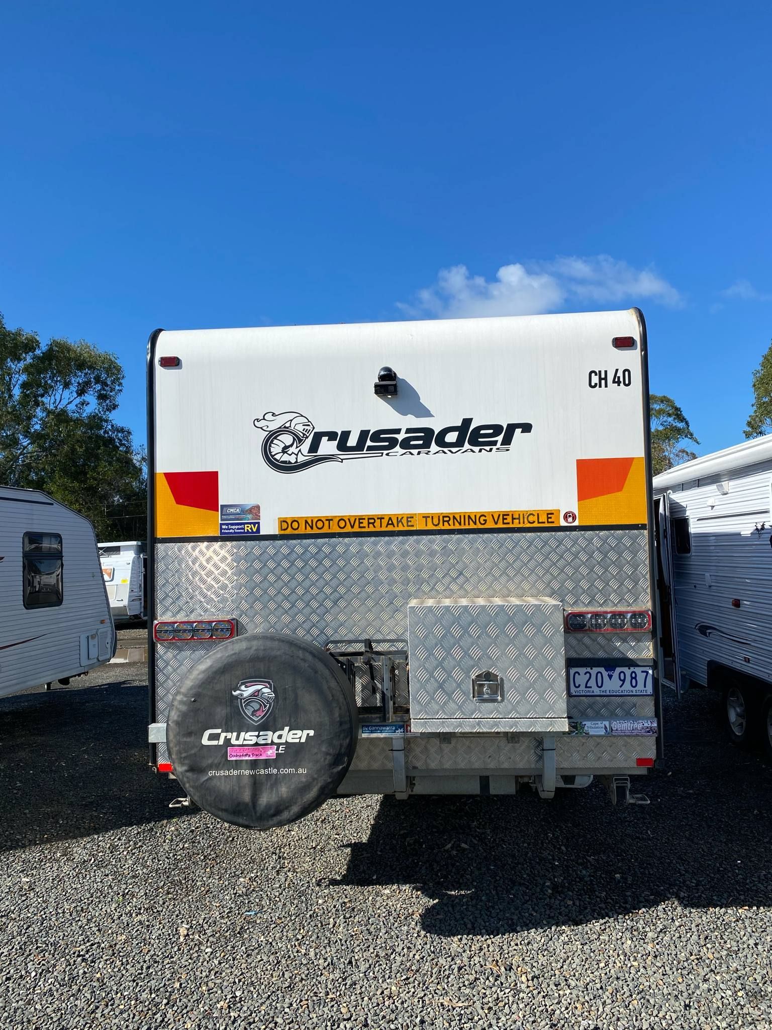 White and Silver Crusader Caravan With Spare Tire — Great Lakes Caravans & RV P/L In Maitland, NSW