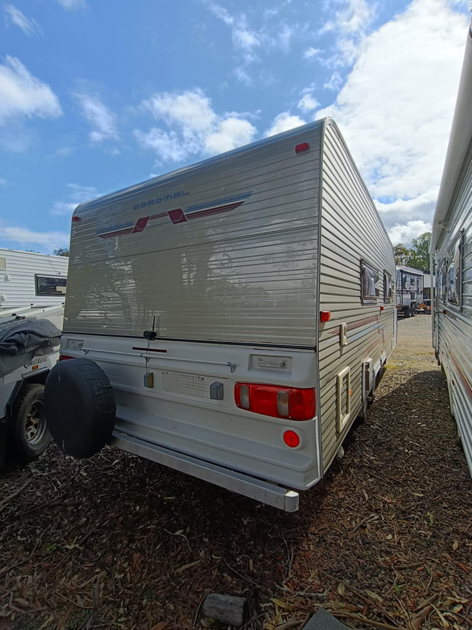 Rear View of a Silver Travel Trailer Parked Outdoors — Great Lakes Caravans & RV P/L In Forster, NSW
