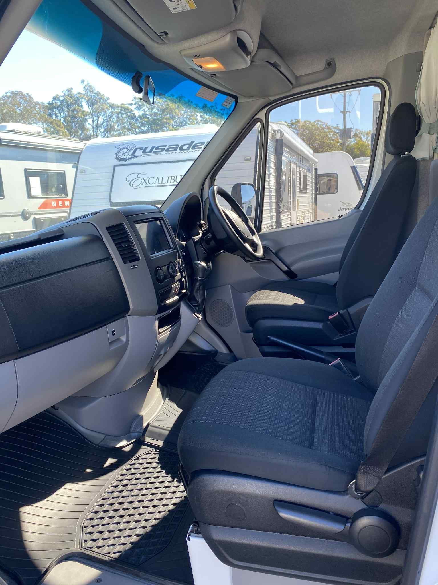 Interior of a White Van With Black Seats — Great Lakes Caravans & RV P/L In Nabiac, NSW