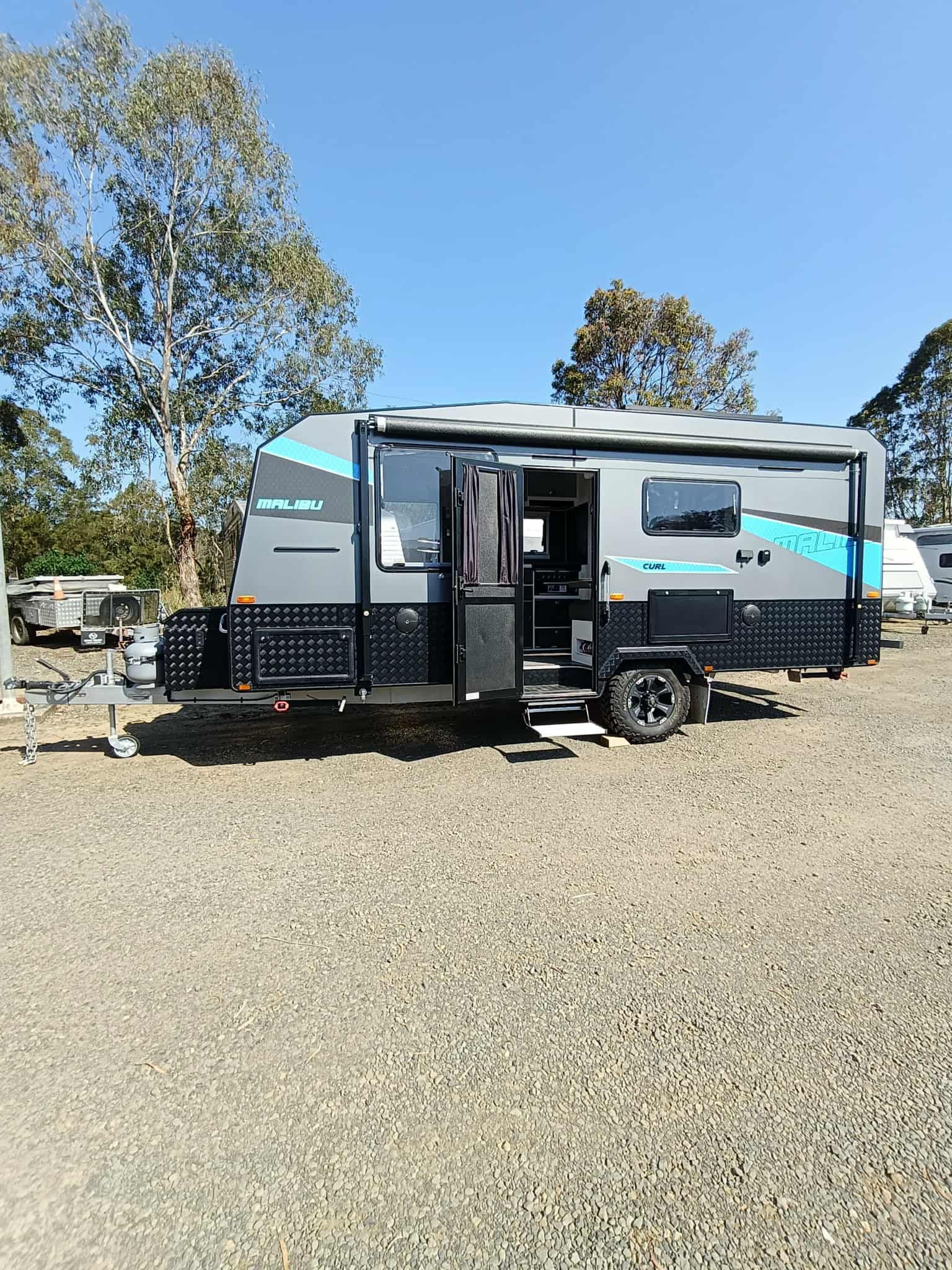 Modern Camper Trailer With Open Door — Great Lakes Caravans & RV P/L In Nabiac, NSW