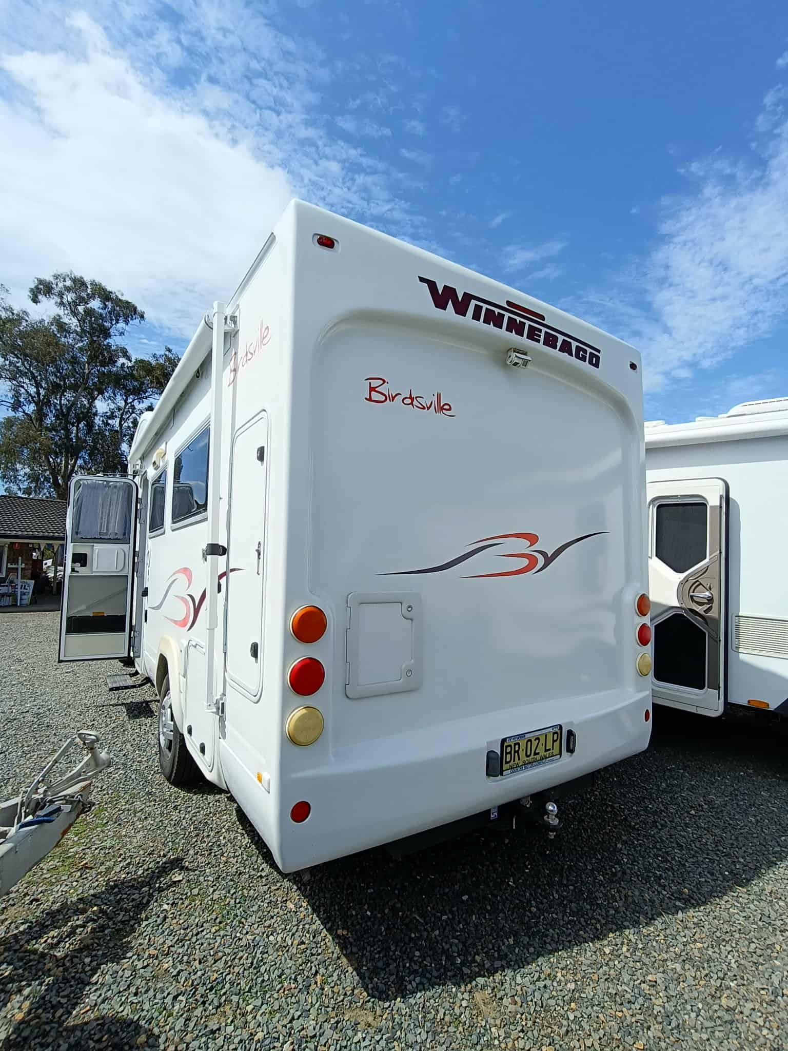 White Caravan With Red and Black Graphics and Round Taillights — Great Lakes Caravans & RV P/L In Nabiac, NSW