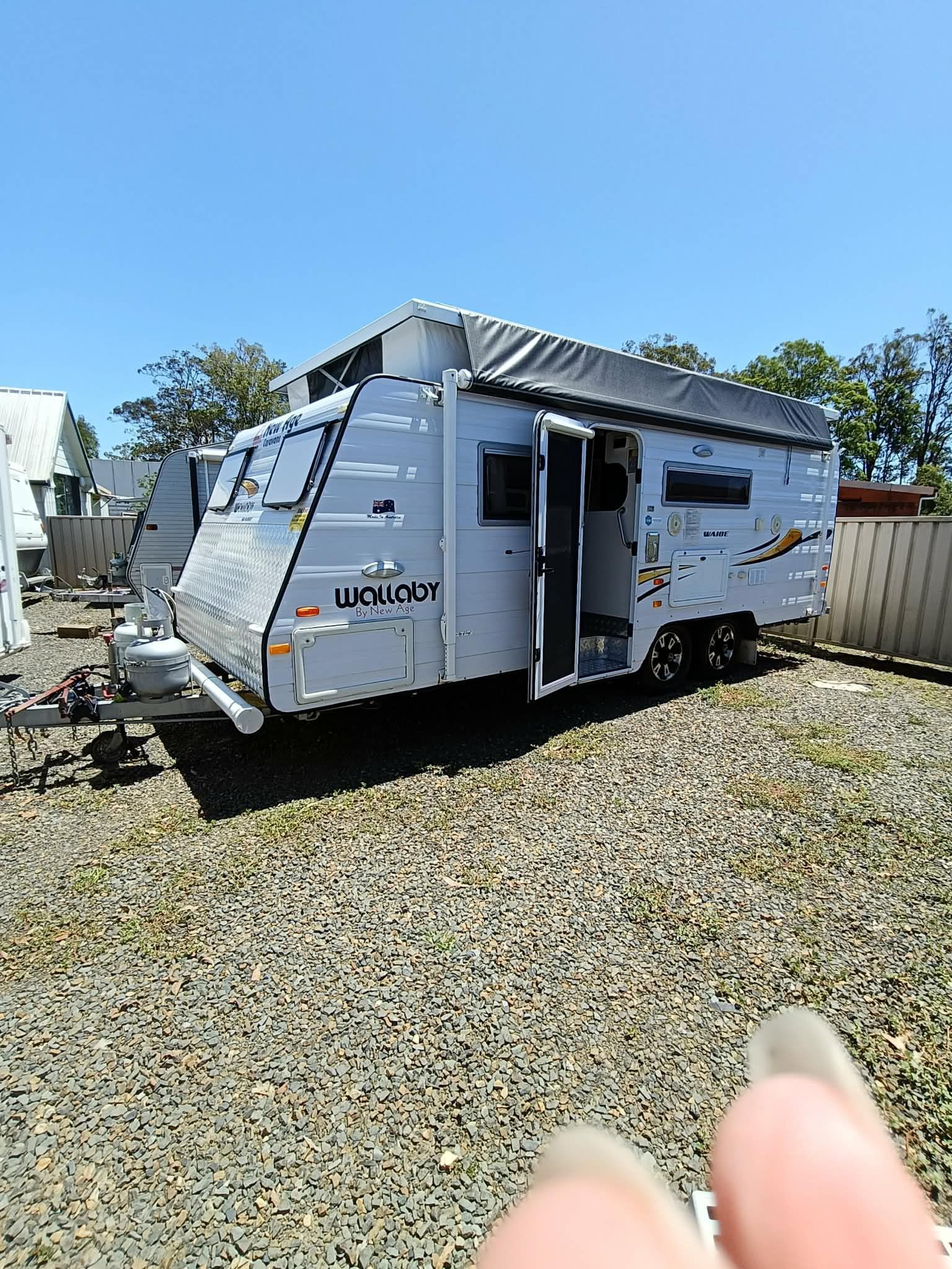 A White and Beige Pop-top Caravan Parked Outside — Great Lakes Caravans & RV P/L In Nabiac, NSW