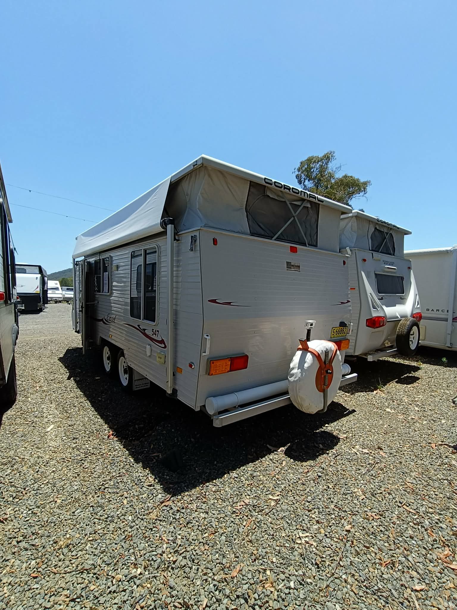 Grey Pop-top Caravan Parked on Gravel — Great Lakes Caravans & RV P/L In Port Macquarie, NSW