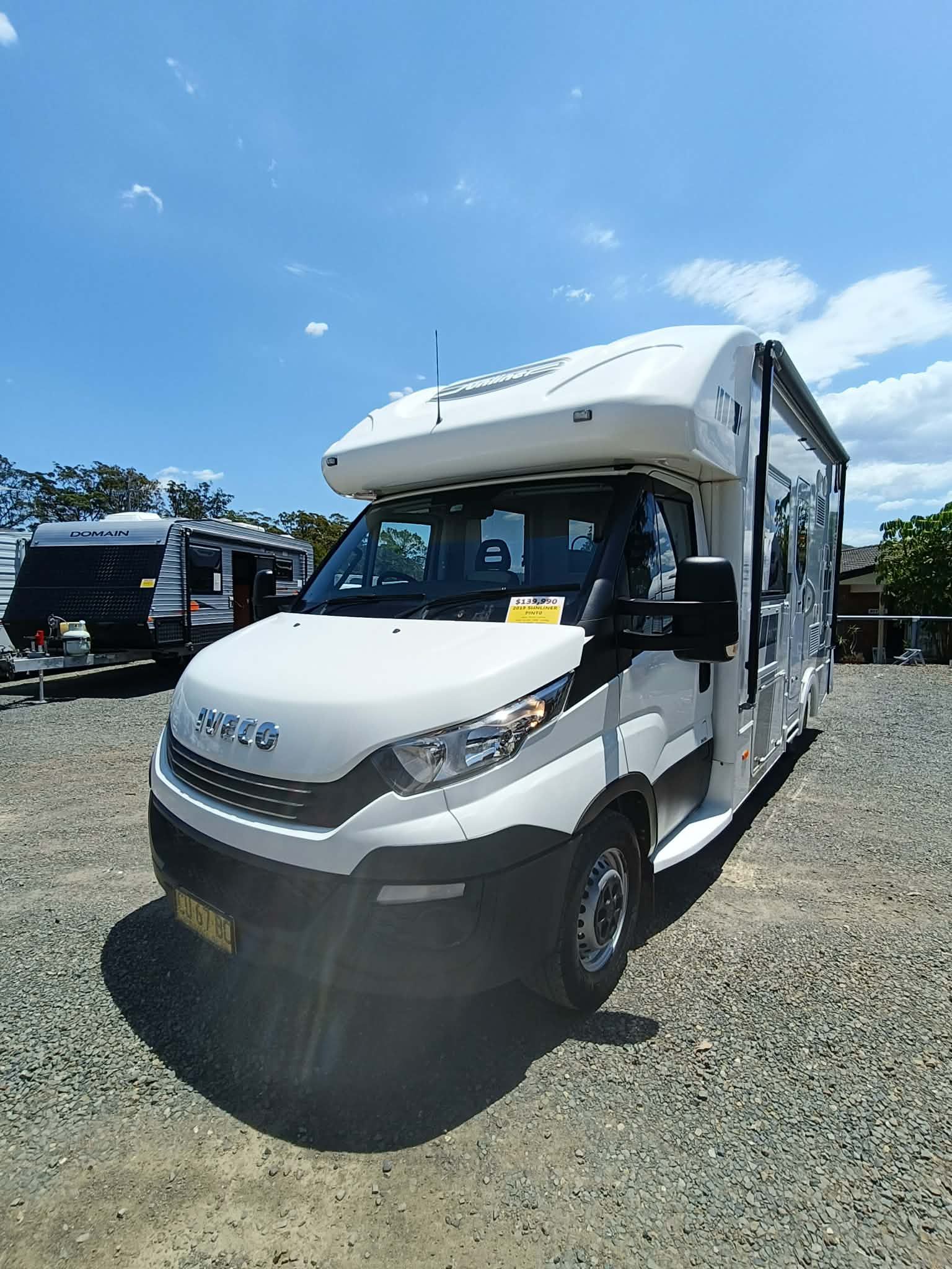 White RV Parked on Gravel Under a Blue Sky — Great Lakes Caravans & RV P/L In Maitland, NSW