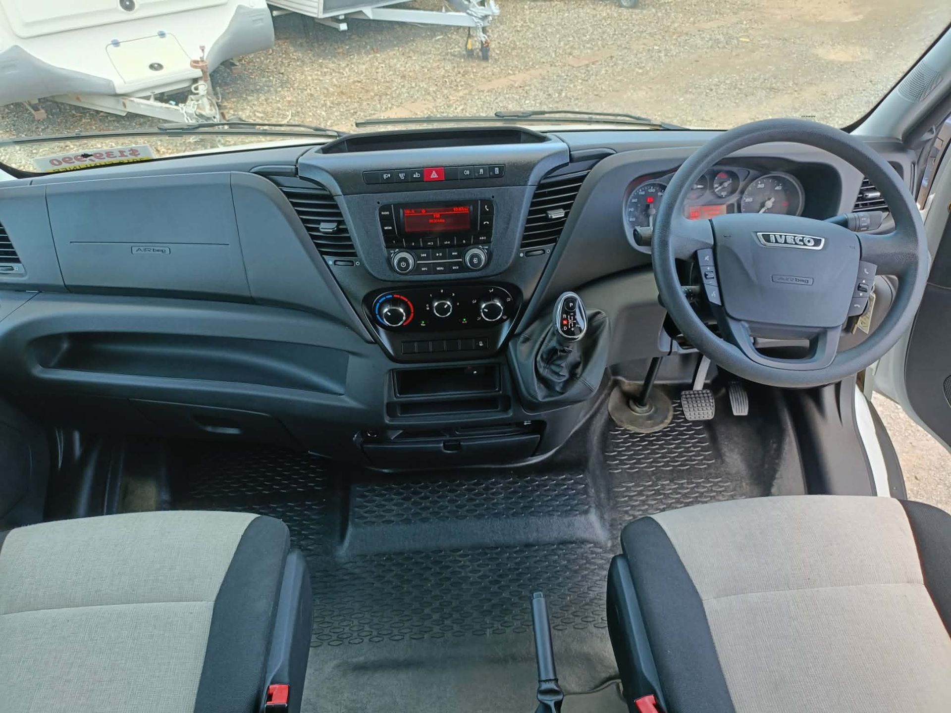 Interior View of a White Van's Dashboard and Seats — Great Lakes Caravans & RV P/L In Hunter Valley, NSW