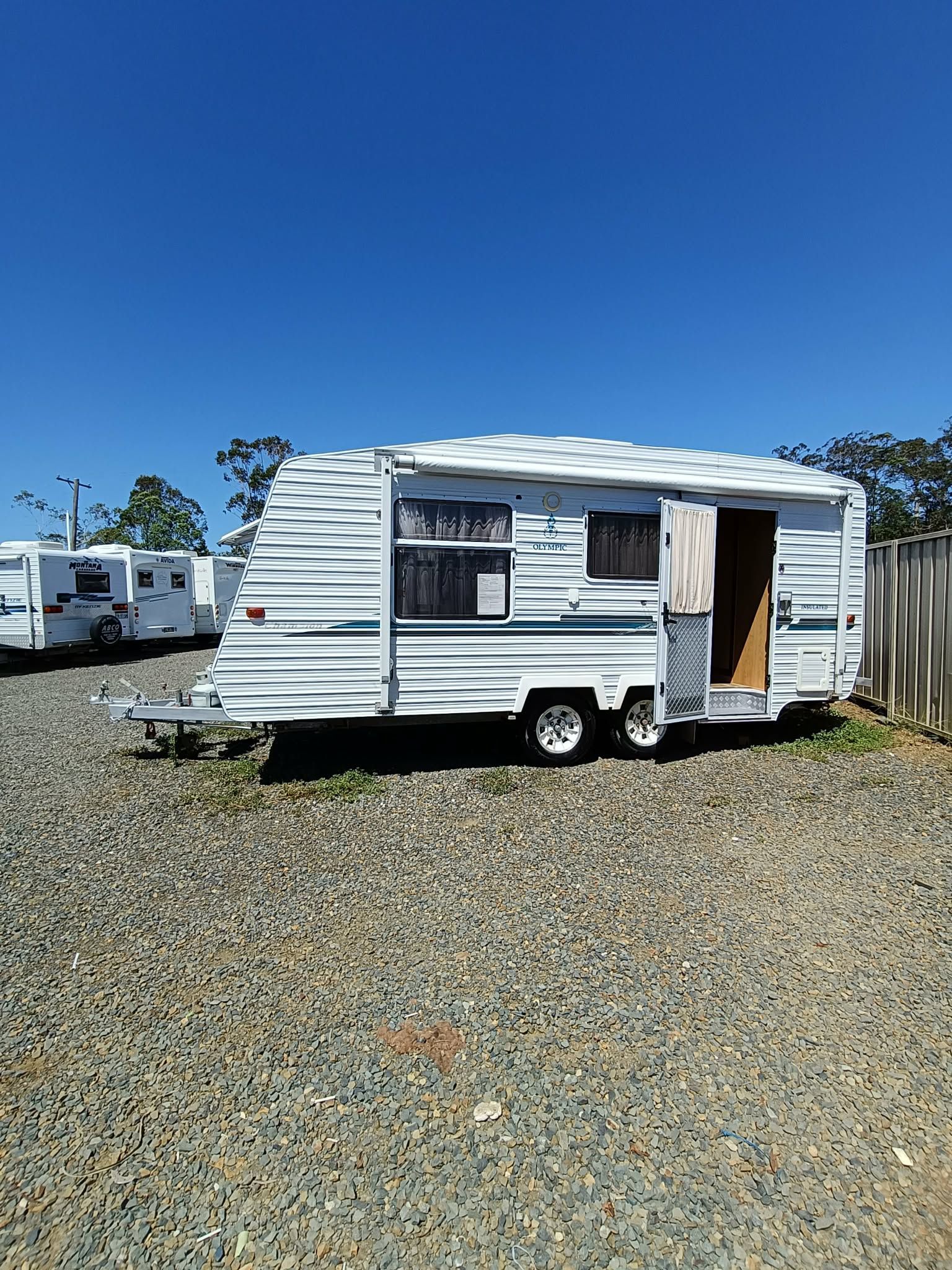 White Caravan With a Door Open — Great Lakes Caravans & RV P/L In Forster, NSW