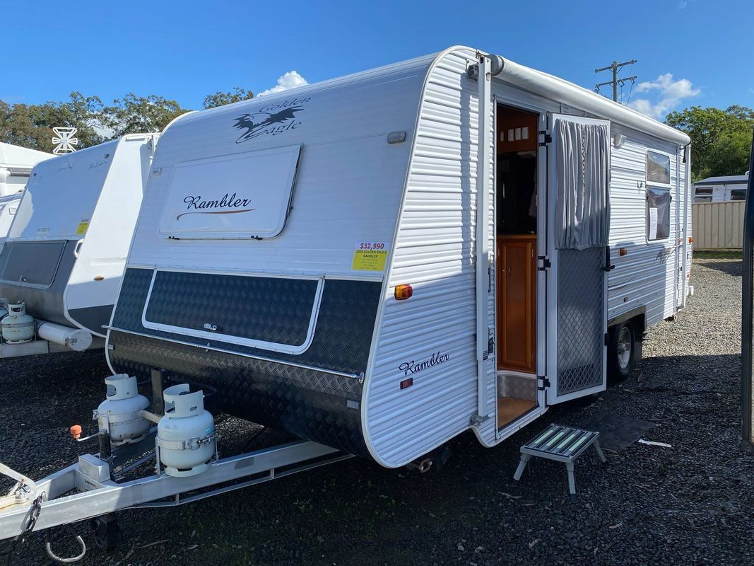White and Gray Travel Trailer With Open Door, Parked Outdoors — Great Lakes Caravans & RV P/L In Nabiac, NSW
