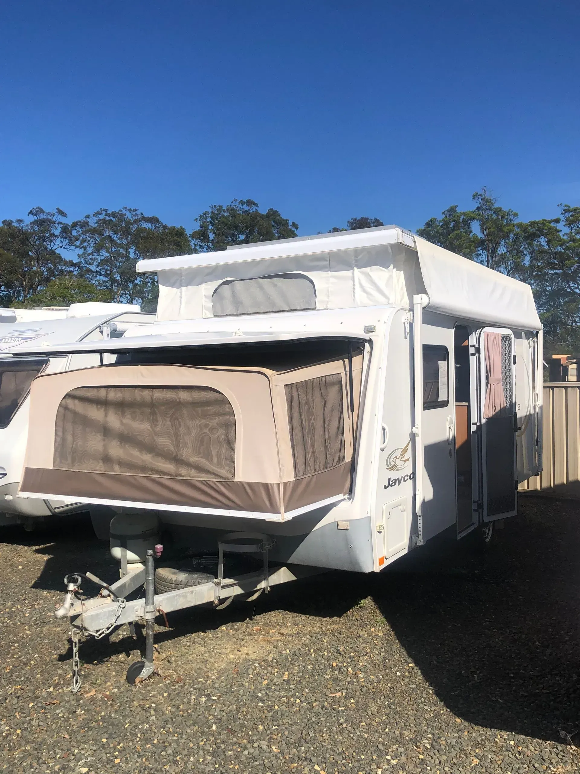 White and Beige Pop-top Caravan Parked Outside — Great Lakes Caravans & RV P/L In Nabiac, NSW