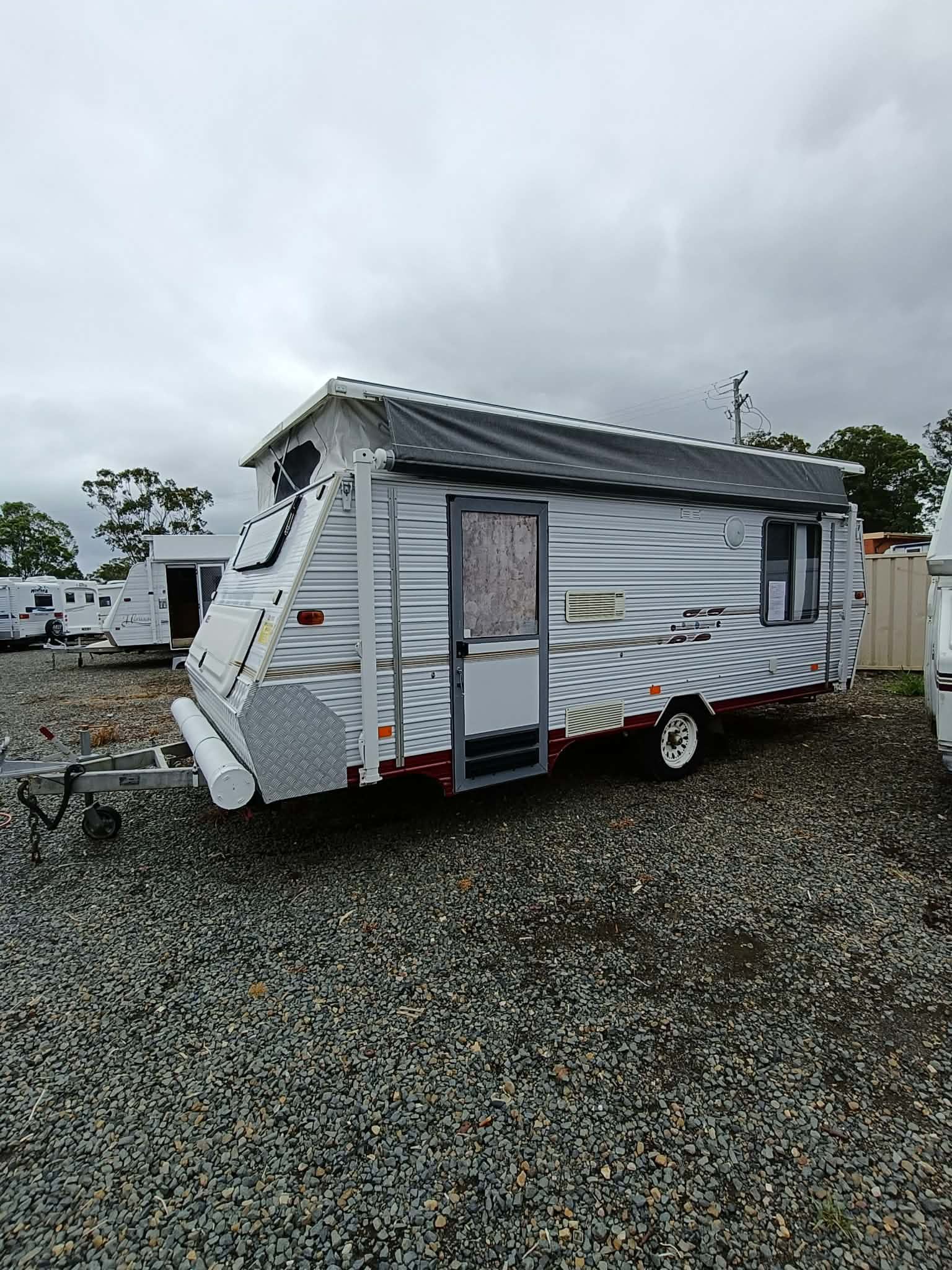 Small, White and Gray Travel Trailer Parked — Great Lakes Caravans & RV P/L In Nabiac, NSW