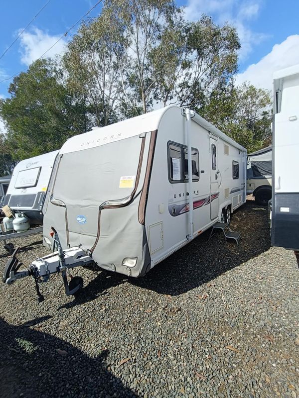 White Caravan Parked on Gravel, Covered Front, Awning Extended, Sunny Outdoor Setting — Great Lakes Caravans & RV P/L In Nabiac, NSW
