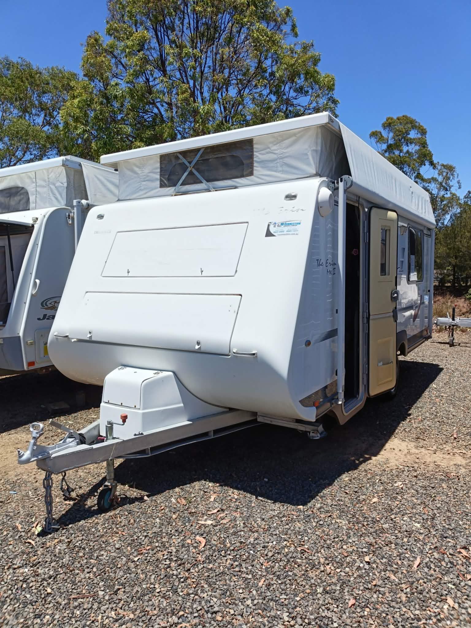 White Pop-top Caravan With Open Door, Parked Outdoors — Great Lakes Caravans & RV P/L In Nabiac, NSW