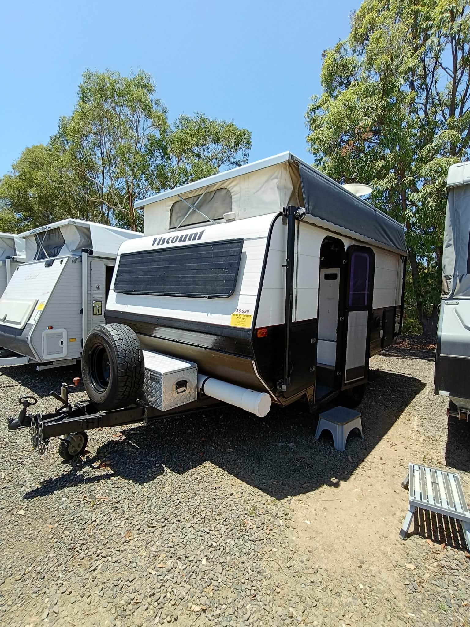 White and Black Pop-top Caravan Parked — Great Lakes Caravans & RV P/L In Nabiac, NSW