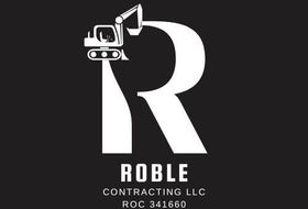 The logo for roble contracting llc has a bulldozer on it.