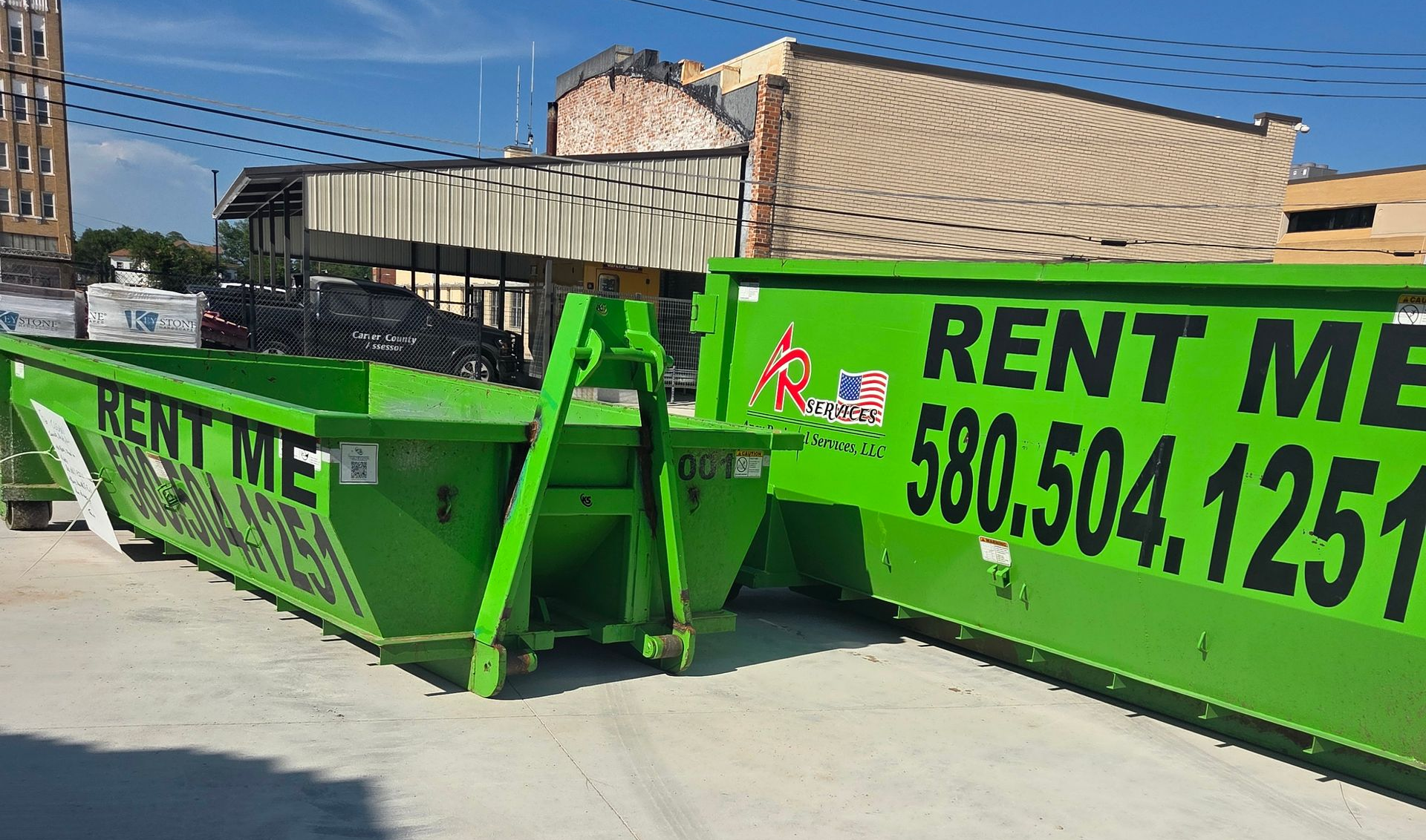 Green dumpster with 