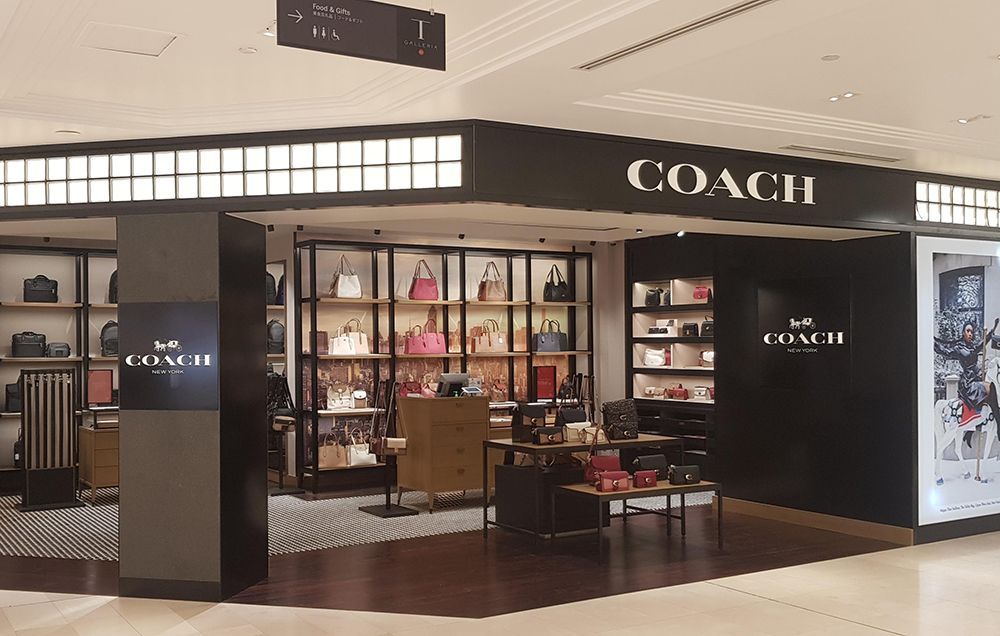 A Coach Store with Lots of Handbags on Display — Cairns Excel Electrics In Bungalow, QLD