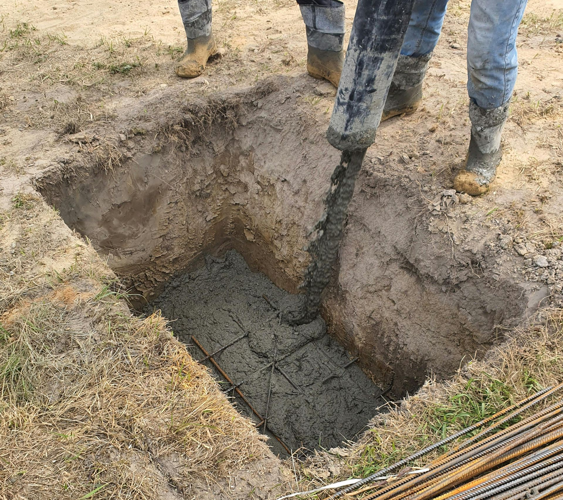 A person is operating an excavator on a construction site.