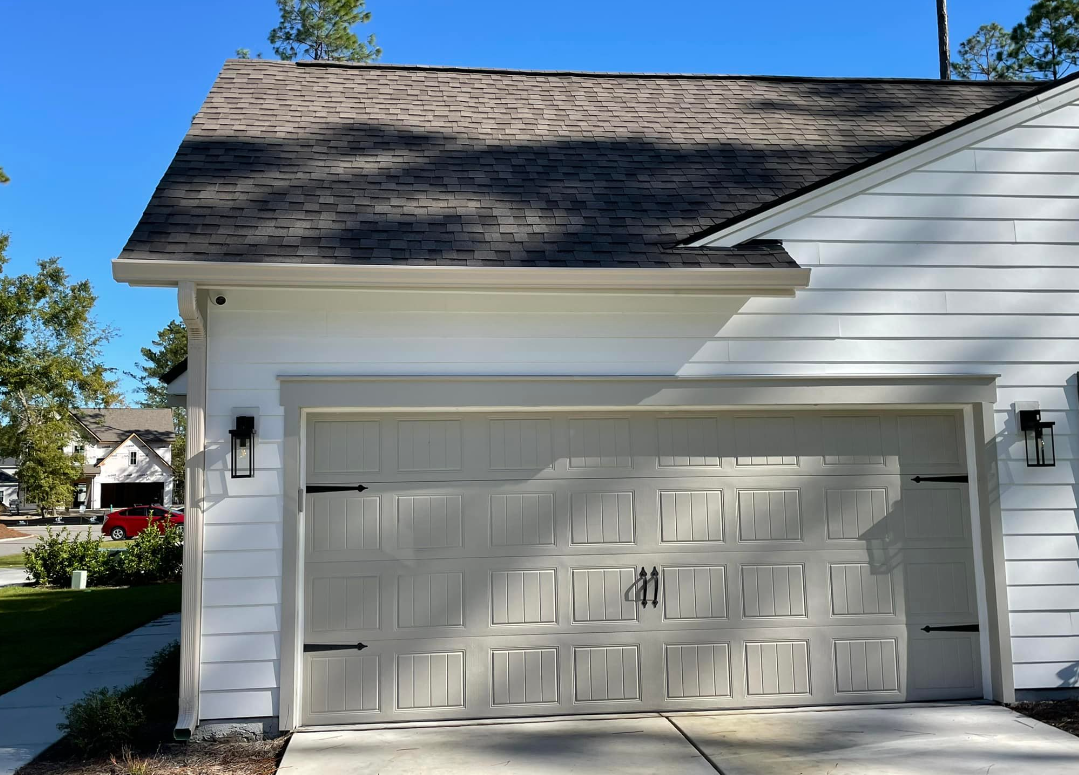 A White Garage With A Black Door And Black Hinges — Richmond Hill, GA — A Plus