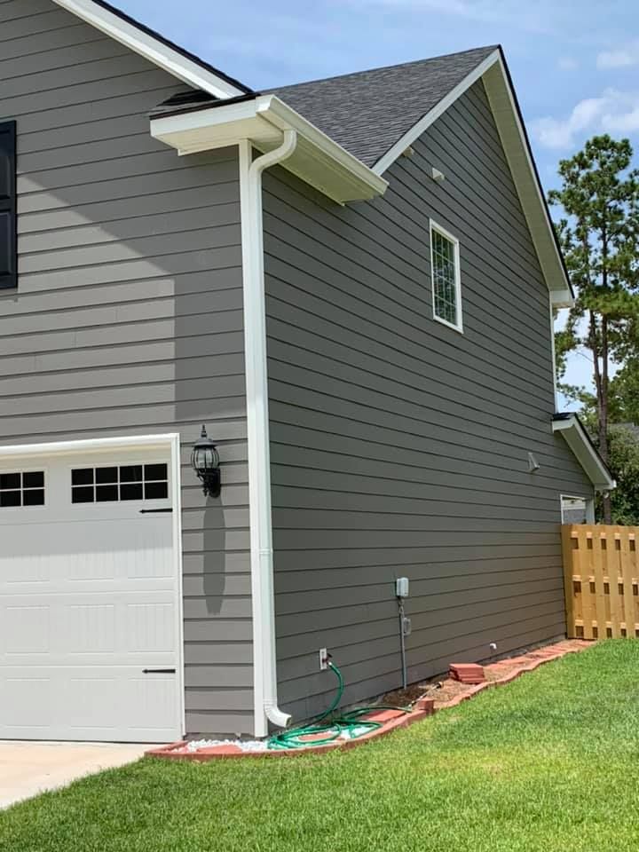 A Gray House With A White Garage Door — Richmond Hill, GA — A Plus