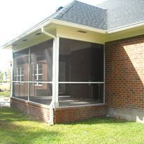 A Screened In Porch On The Side Of A Brick House — Richmond Hill, GA — A Plus