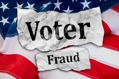 A torn piece of paper with the words voter fraud written on it
