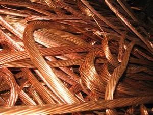 Close-up of tangled copper wire strands with a shiny metallic texture