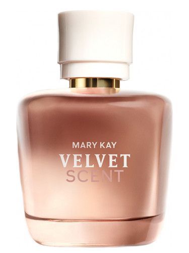 Frasco de perfume Mary Kay Velvet Scent, vidrio degradado rosa-marrón, tapón blanco, collar dorado y texto blanco centrado.