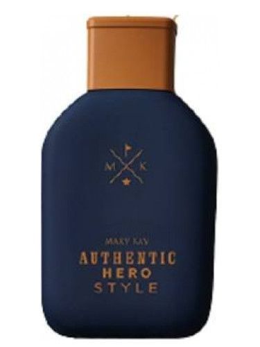 Botella de colonia de color azul oscuro con tapón de bronce y etiqueta que dice 