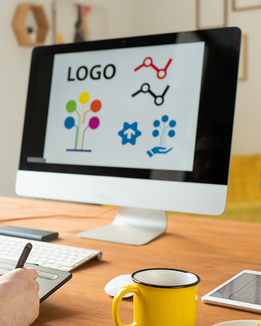 Female doing yoga while watching yoga videos on her laptop