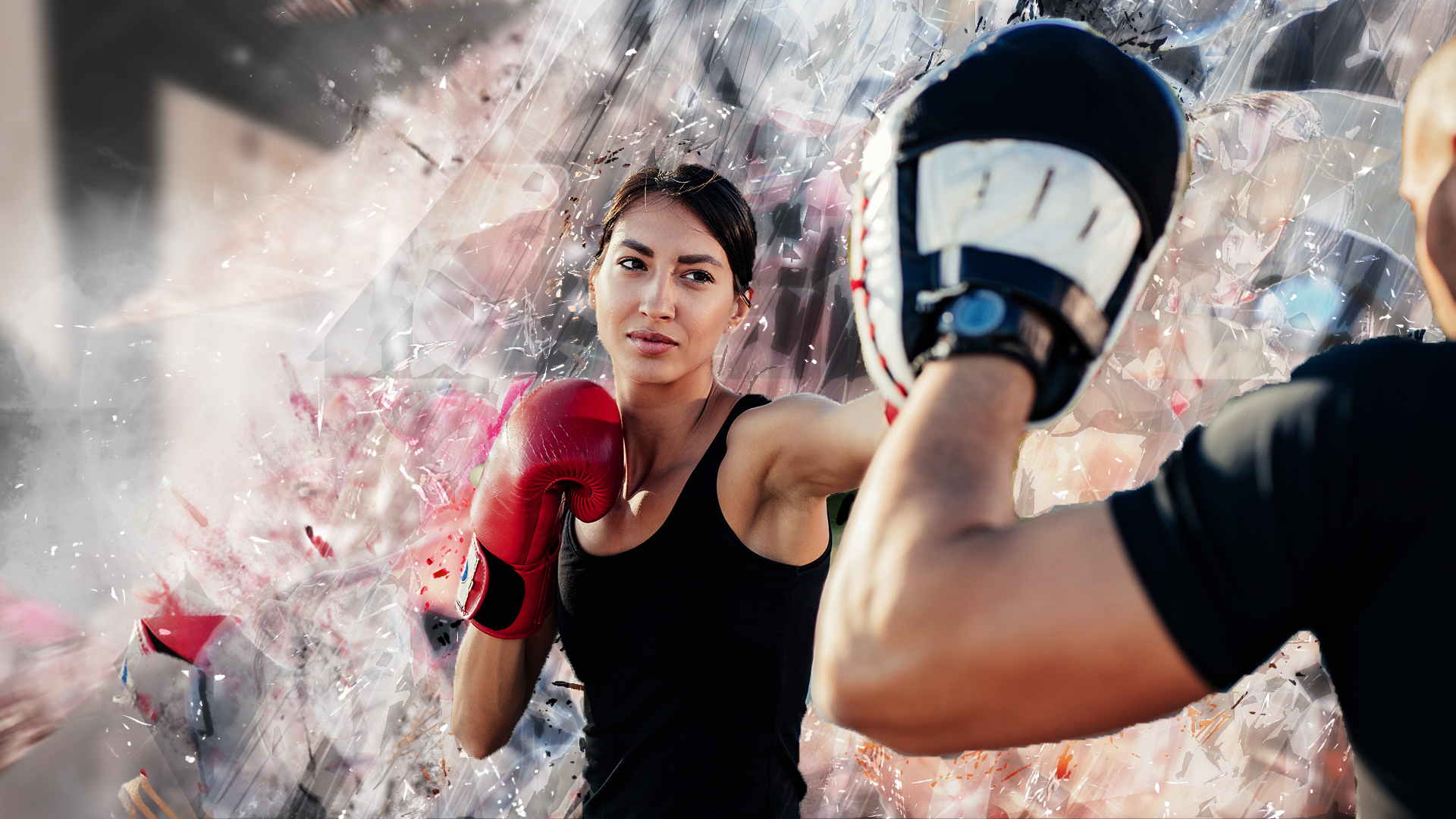 Female punching boxing pads