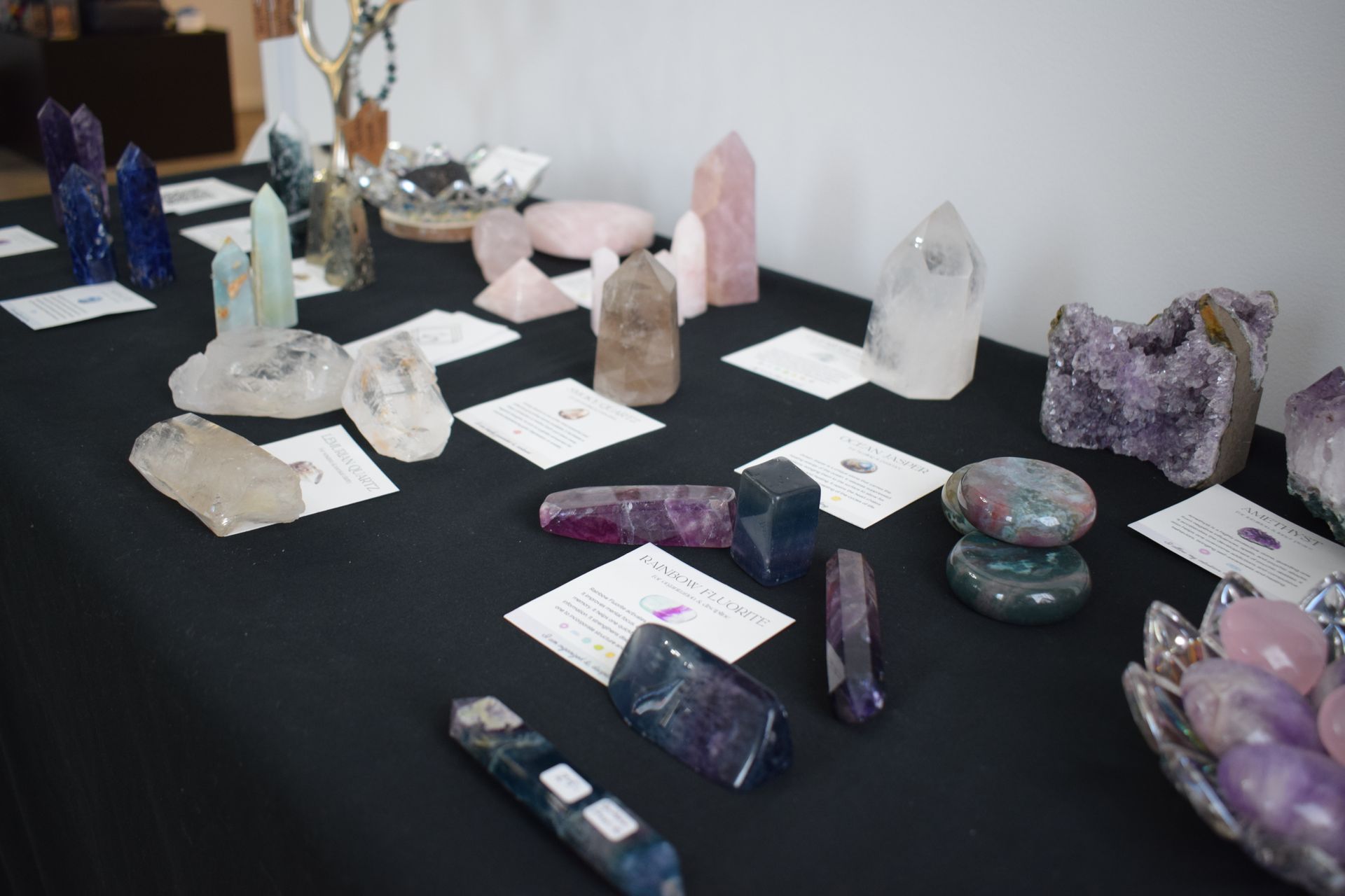 There are many different types of crystals on the table.