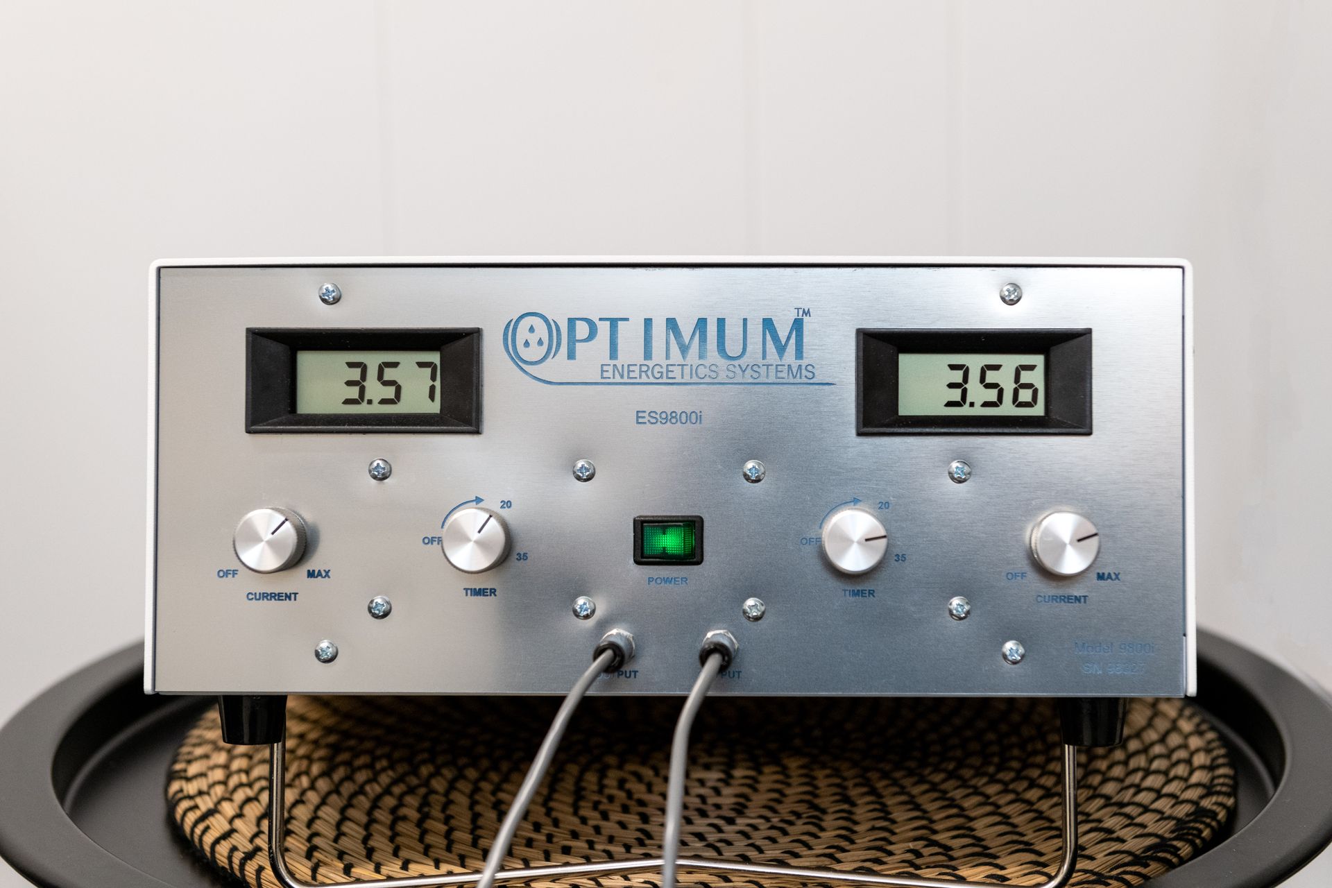 A silver optimum device is sitting on a table