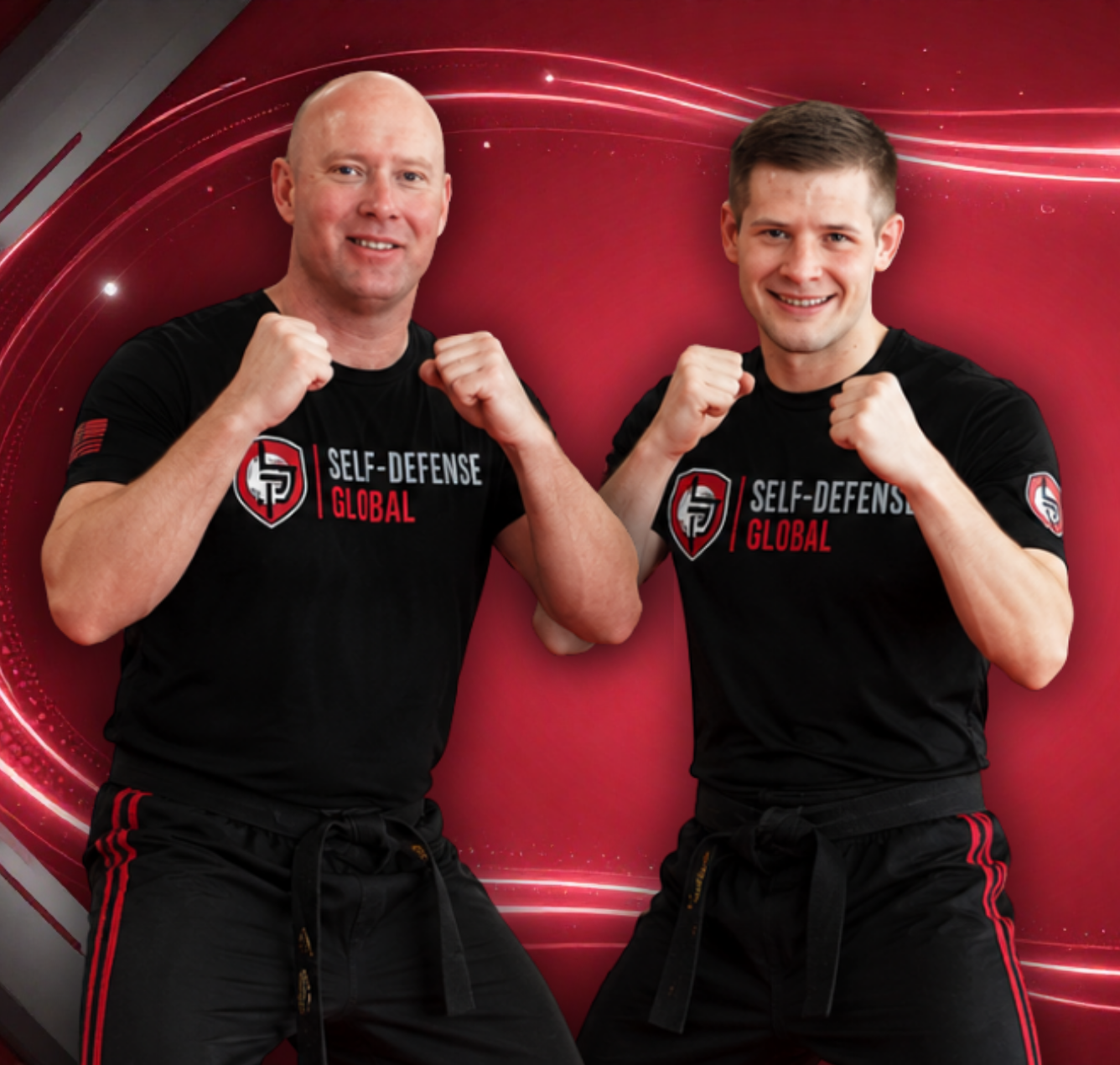 Two men in black Self-Defense Global shirts pose with raised fists against a red graphic background