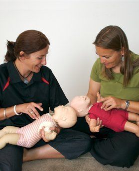 Practising CPR on baby manikins