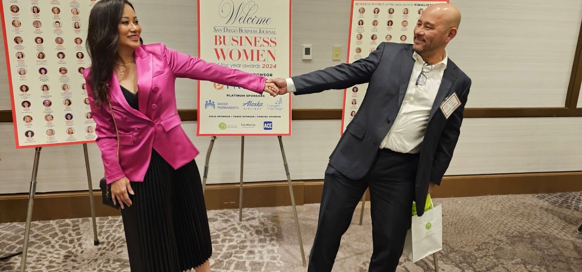 A man and a woman are standing next to each other in a room.