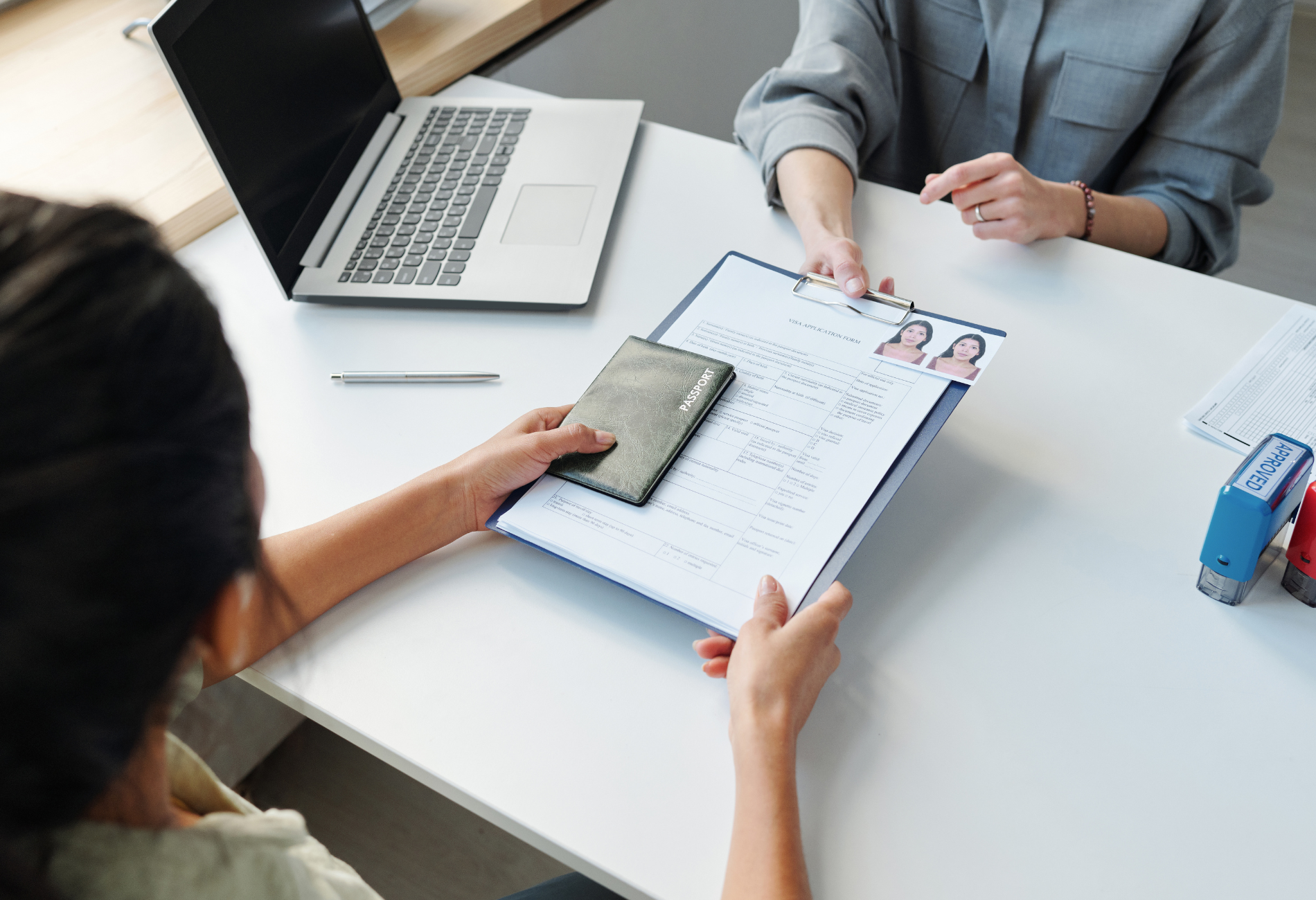 A car is driving down a city street at night.