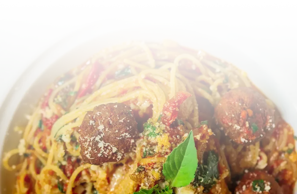 A plate of pasta and meatballs