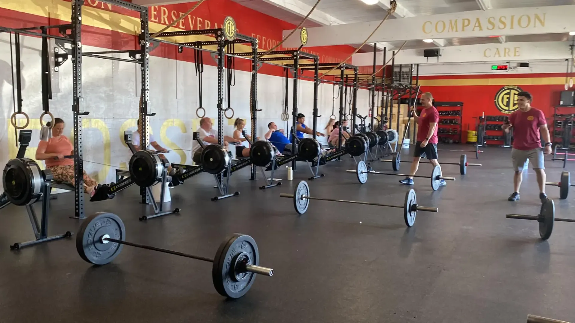 A group of people are working out in a gym.