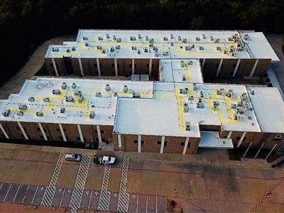 A commercial spray-on roof coating in Waxahachie, TX by A-Z Roofing Solutions