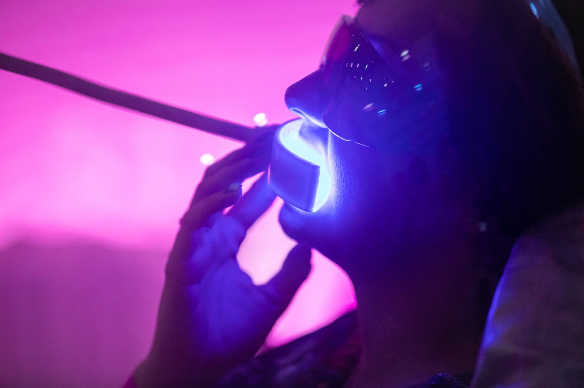 a woman getting her teeth whitened cosmetically