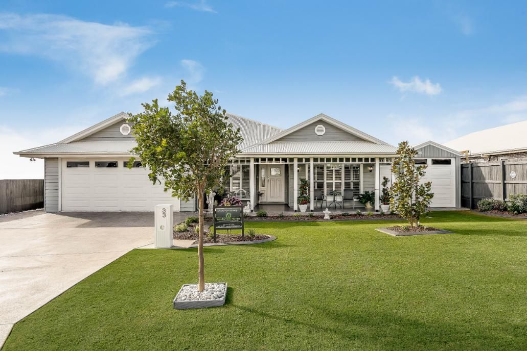 A White House With a Tree in Front — Windamere Homes in Highfields, QLD