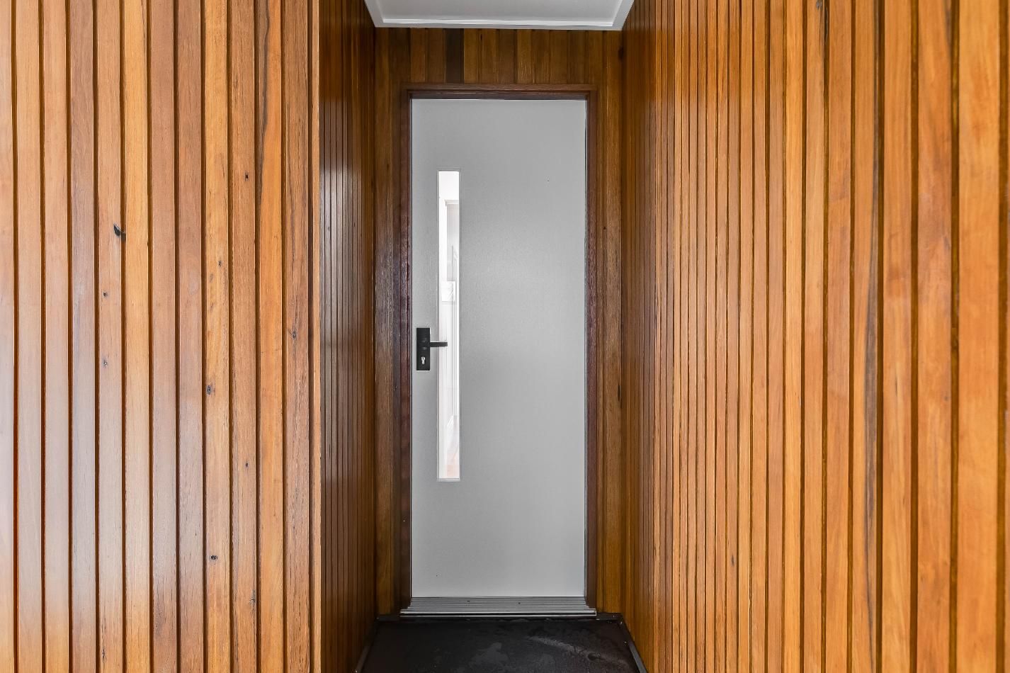 A White Door is Sitting in a Hallway — Windamere Homes in Highfields, QLD