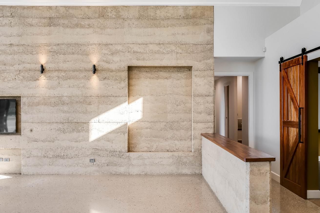 A Room With a Brick Wall and a Door — Windamere Homes in Highfields, QLD