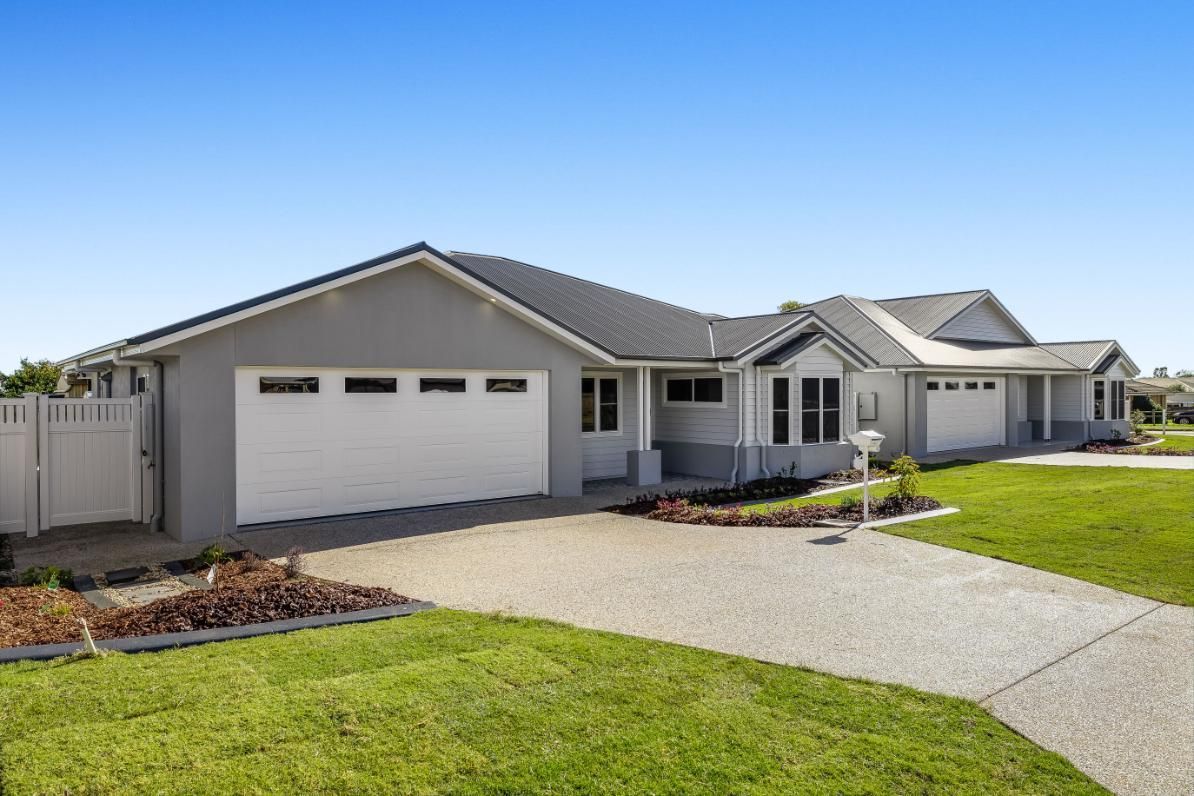 A Large House With Two Garage Doors — Windamere Homes in Highfields, QLD