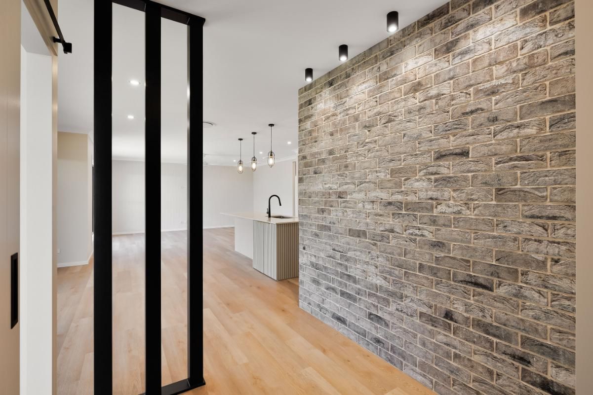 A Hallway With a Kitchen — Windamere Homes in Highfields, QLD
